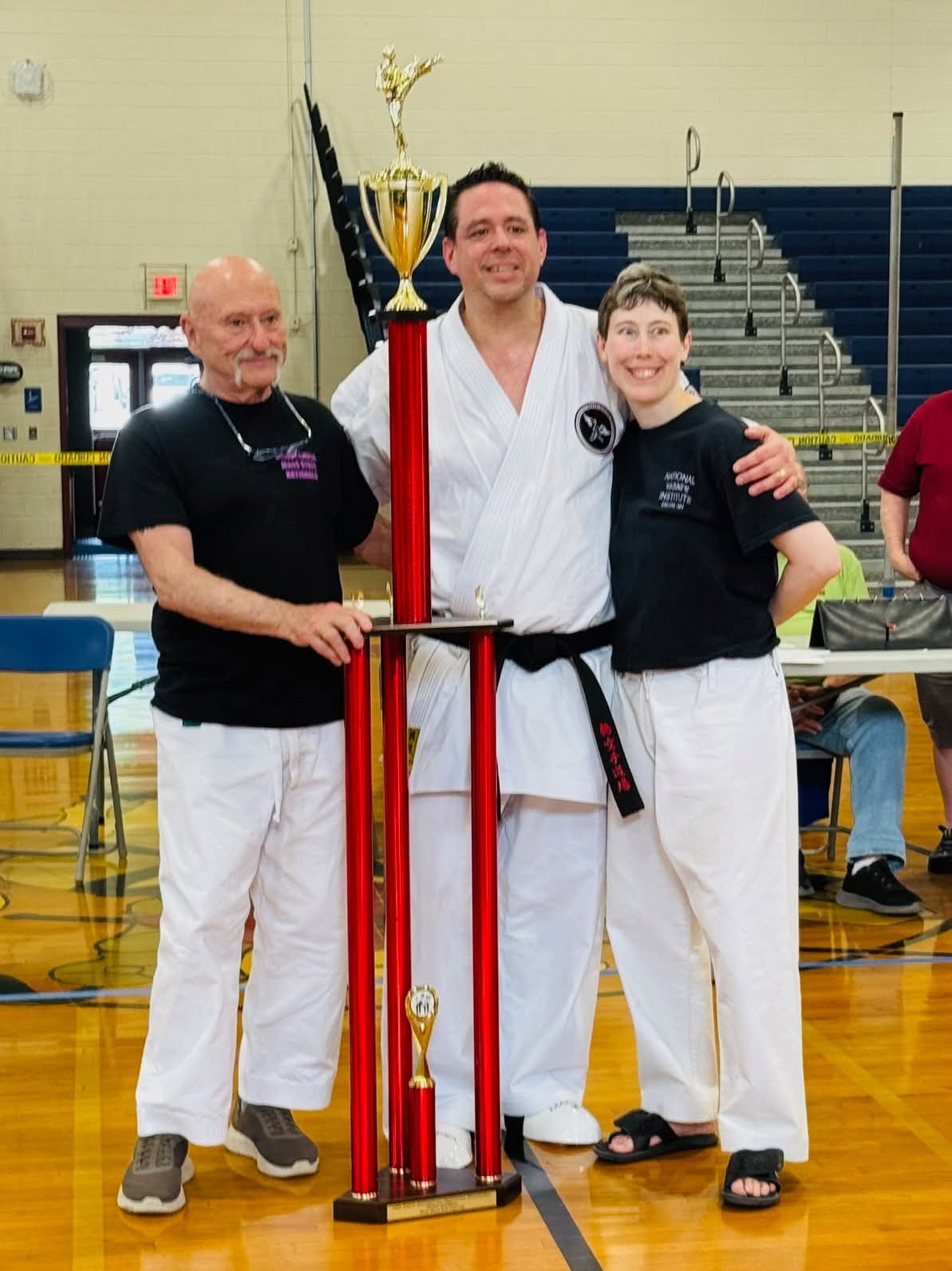 Crane Karate Academy grand champion with trophy